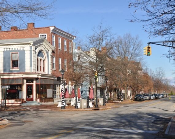 Historic downtown Burlington, NJ along High Street, featuring brick buildings, local shops, and a quiet street with classic lampposts.